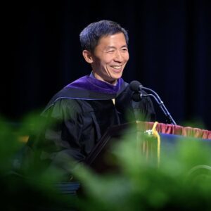 Goodwin Liu speaks behind a lecturn